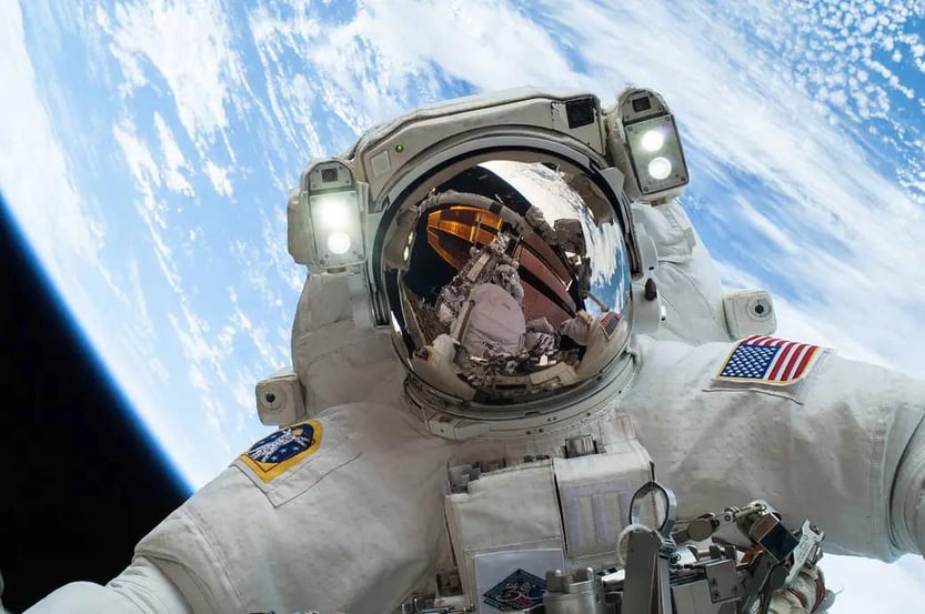 Mike Hopkins, founder of AIYSpace, during a spacewalk while on the International Space Station. This image showcases experience and connection with space exploration. 