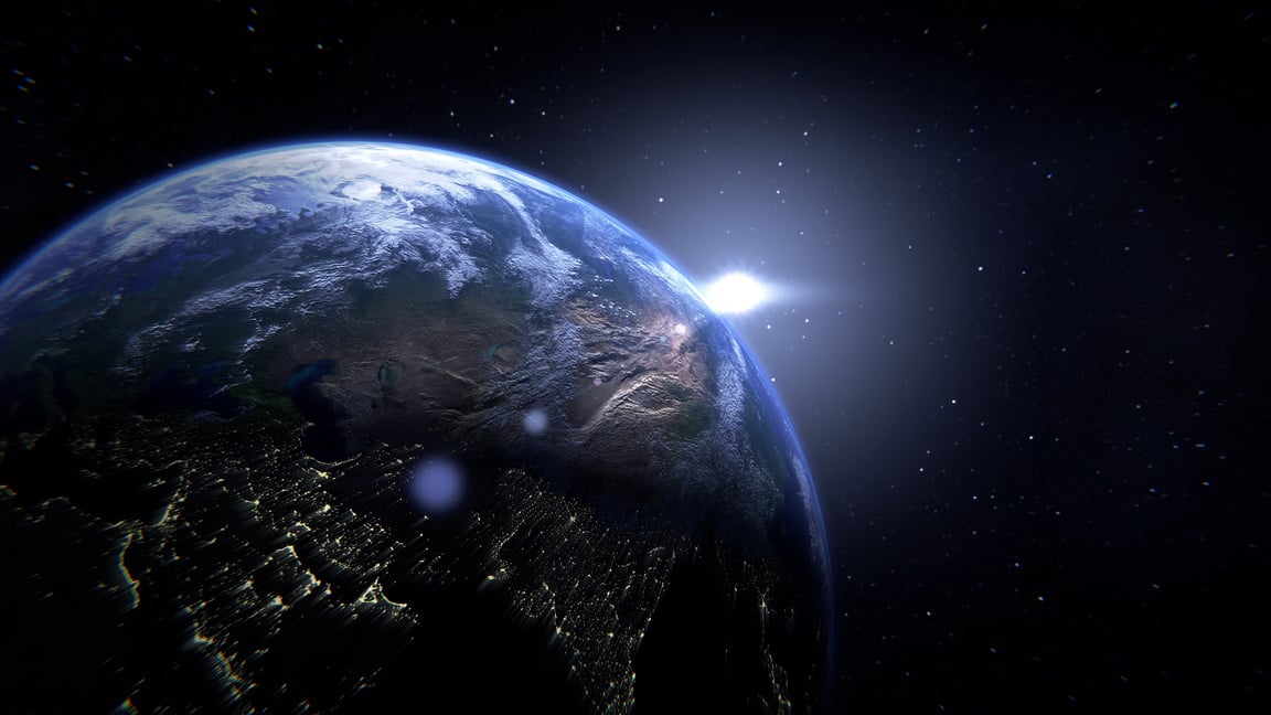 An image of Earth with a star, casting a glow over the planet. This visual evokes the creation story from Genesis 1:1. The image reflects one of the core value of faith. AIYSpace emphasizes the importance of faith as a guiding force in their mission.