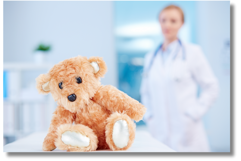 A stock image of a teddy bear sitting on a table in front of a blurred doctor. This represents the children's hospitals that the nonprofit Astronauts in your Space serves.